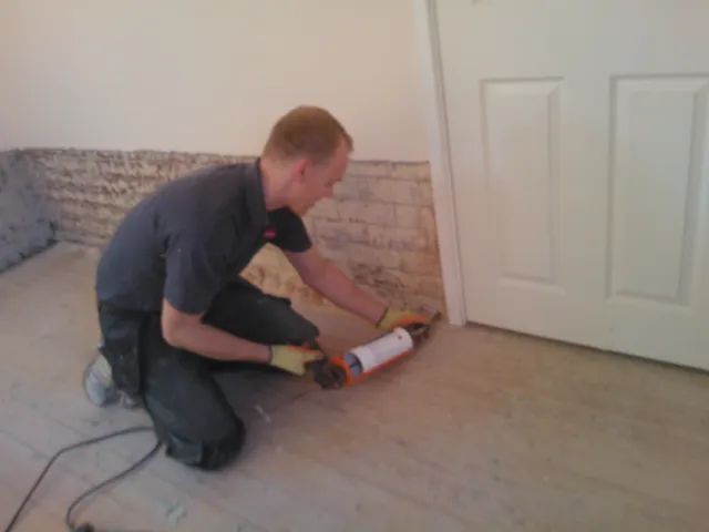 Chris injecting damp proofing