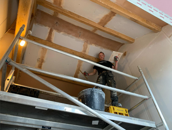 Chris plastering a ceiling