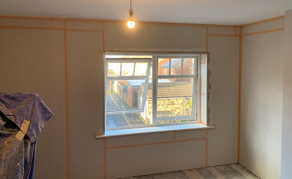 Example of thermal insulated plasterboard around a window.